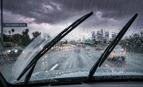 Traditional wiper blades failing badly in heavy rain, showing streaking and poor visibility